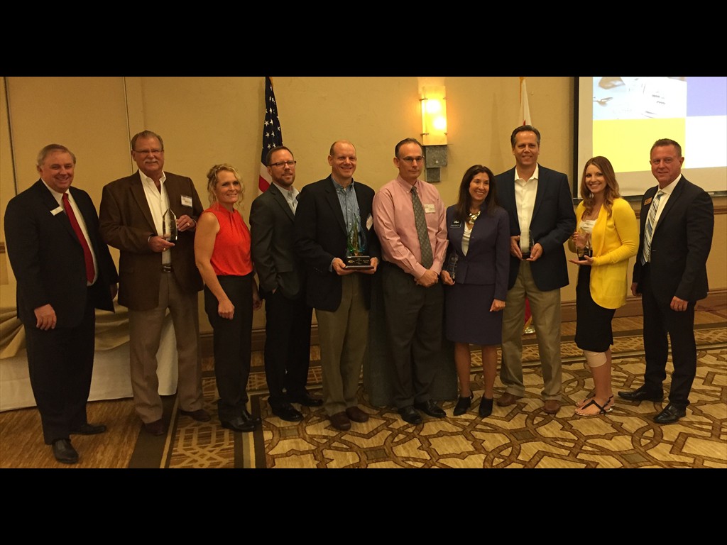 EDC of Southern California Executive Director poses with the 2015 Award Recipients